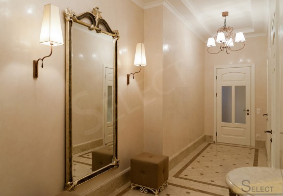 Photo of an ordinary corridor in an apartment in an exquisite classic style