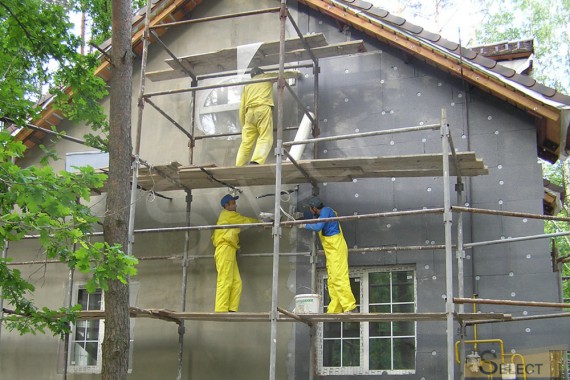 Construction work on the facade. Insulation and painting work