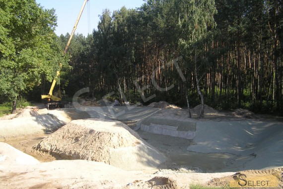 Preparation of a site for an artificial reservoir with fish and an island in the middle