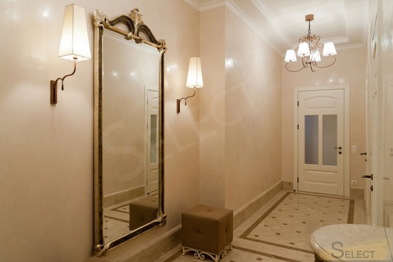 Photo of an ordinary corridor in an apartment in an exquisite classic style