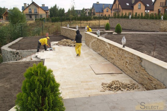 Improvement of the territory near the house - laying tiles for outdoor use